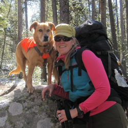 Founder and owner Rachel Cudmore with her dog Kintla backpacking in Montana.